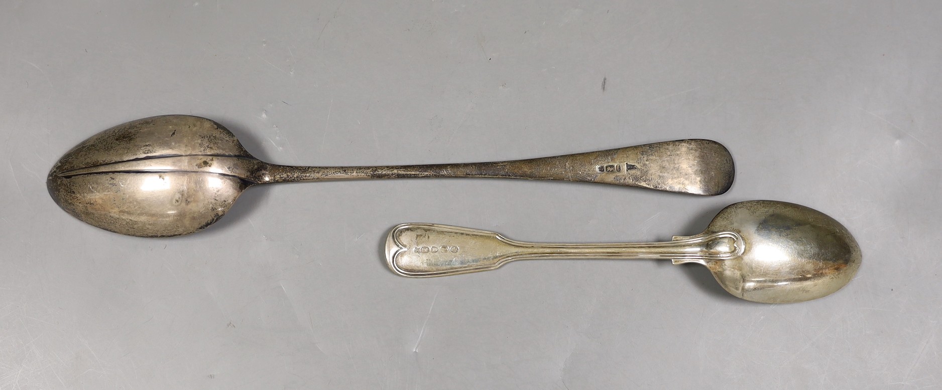 A set of six Victorian silver fiddle and thread pattern table spoons, by George Adams, London, 1864 and a later rat tail pattern basting spoon, Walker & Hall, Sheffield, 1903, 23.2oz.